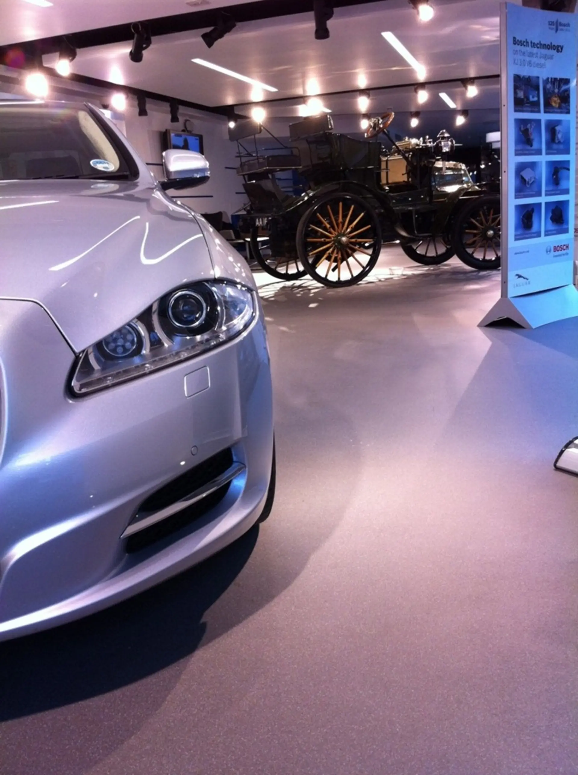 1899 Daimler and 2011 Jaguar XJ on display at SMMT headquarters