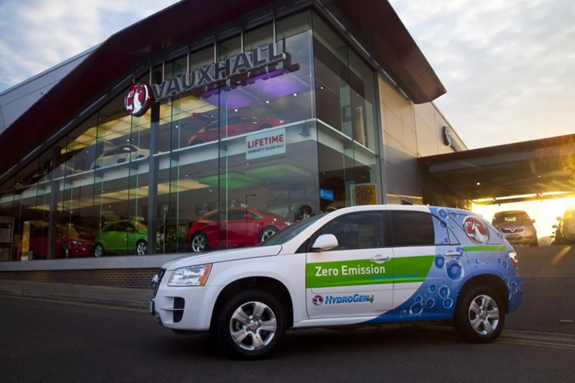 Vauxhall HydroGen4 in front of Vauxhall Retailer