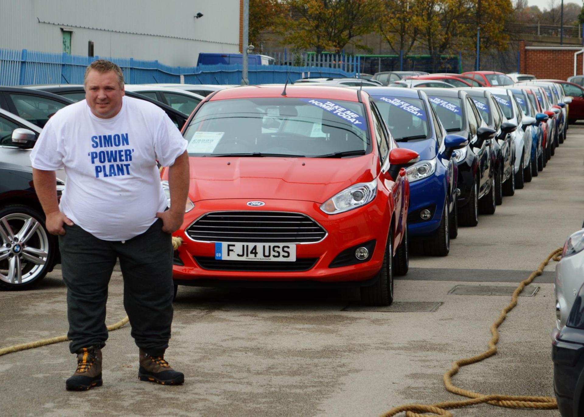 Strongman Simon Plant has smashed the World Record for pulling chained-together cars