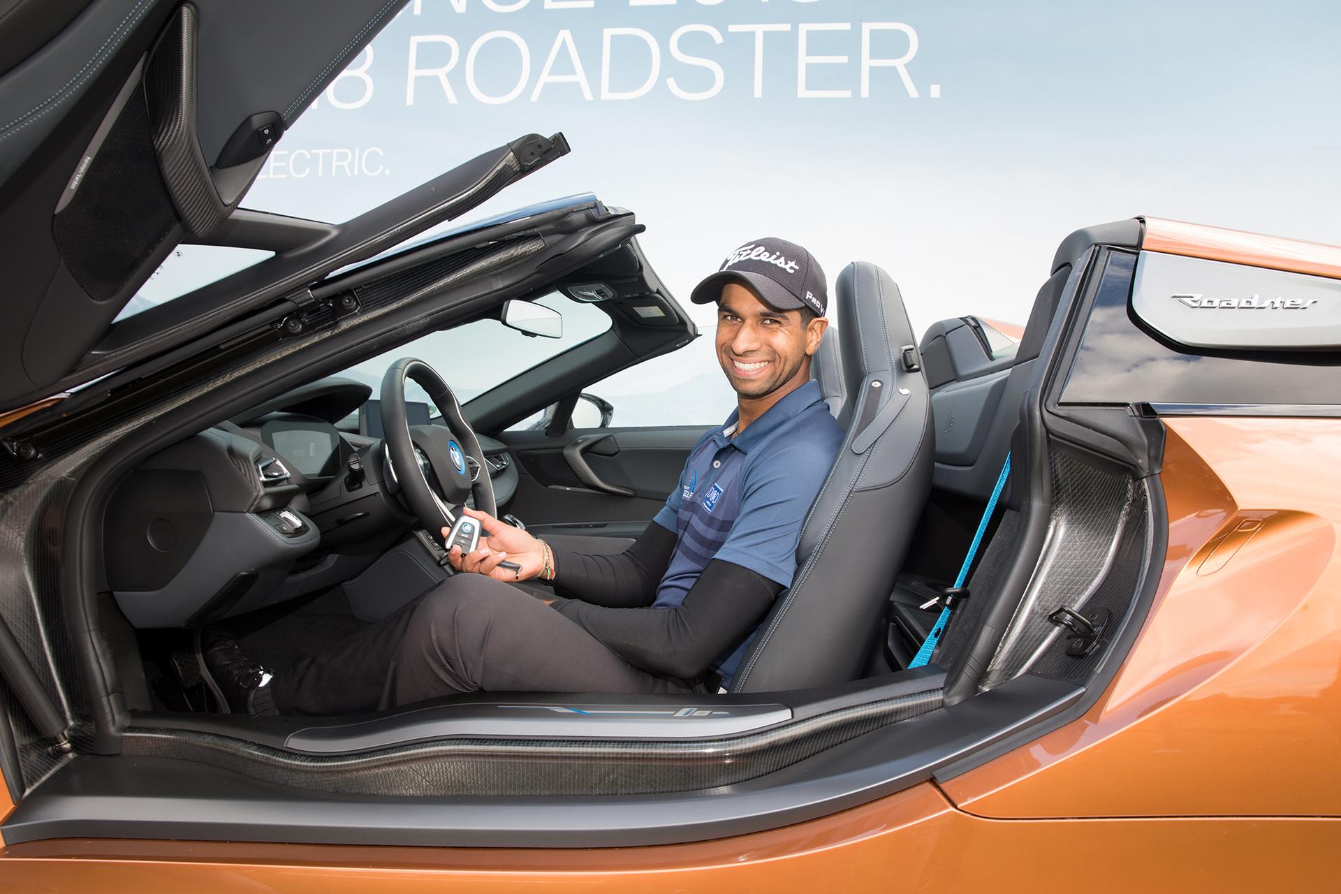 Aaron Rai wins the new BMW i8 Roadster with a hole in one.