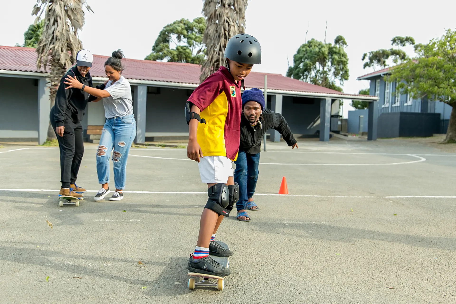 Skateistan Coaches Teaching The Learners Skating Basics