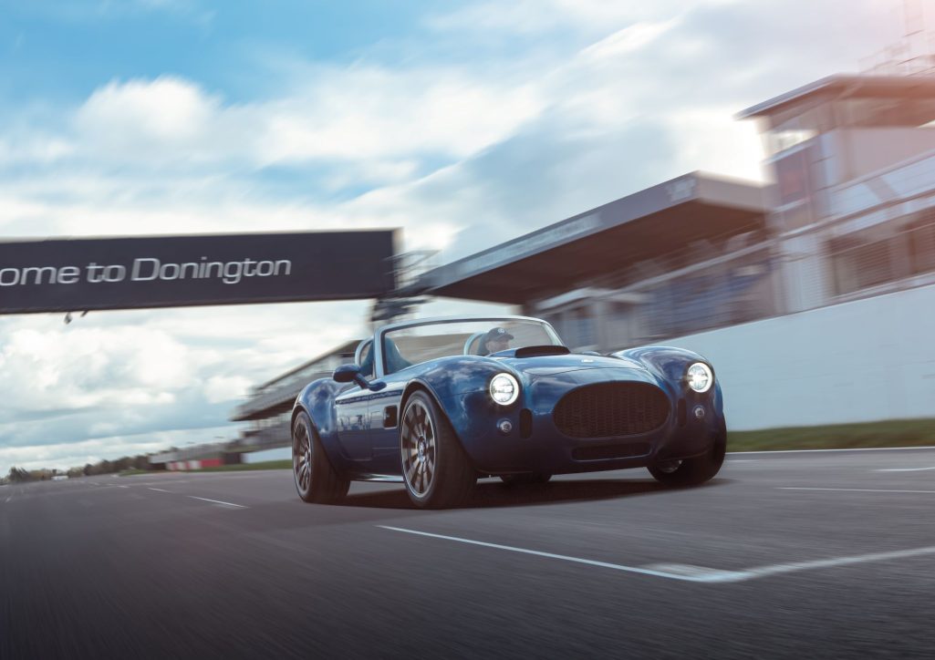 Ac cars celebrates anniversary with production of ac cobra gt roadster at uk facility and bigger donington park hq as it wraps next model for reveal