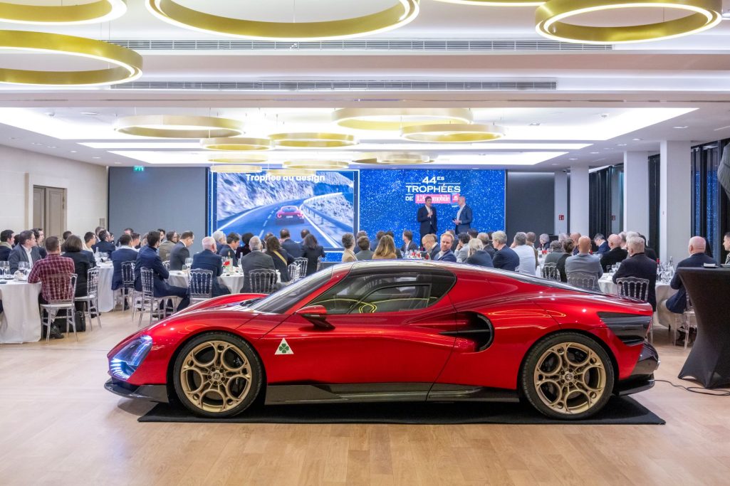 The alfa romeo 33 stradale wins the design trophy awarded by lautomobile magazine